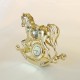 CAVALLUCCIO A SWINGING WITH CLOCK gold - Cm. 10 x 9 - Swarovski Elements